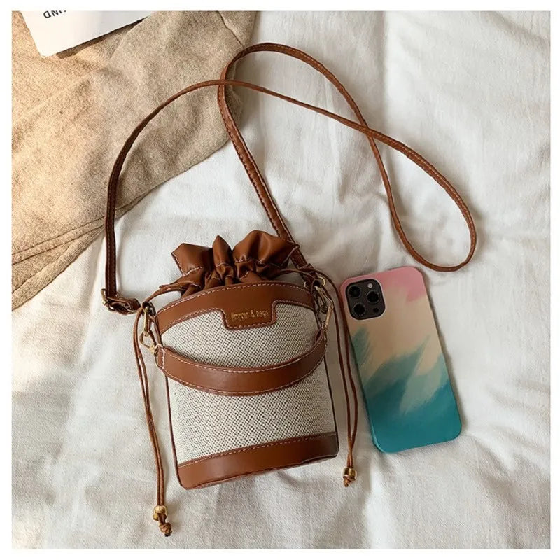 Bolso en forma de cilindro
